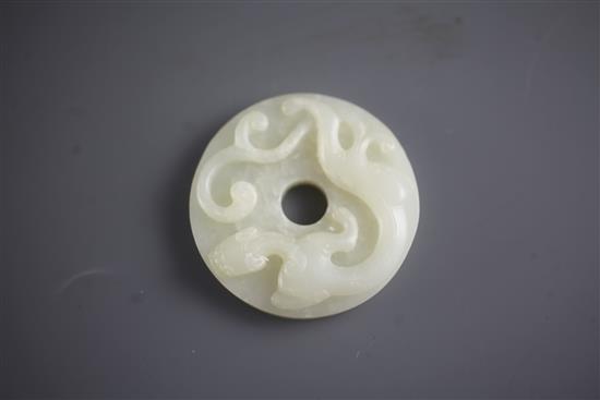 A Chinese white jade bi disc, diameter 4.6cm, wood stand